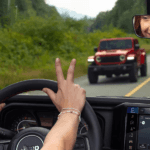 Woman driving a Jeep Wrangler