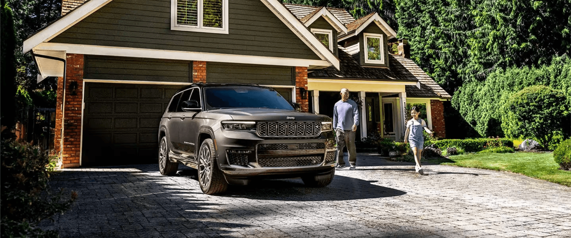 2025 Jeep Grand Cherokee in Front of a House