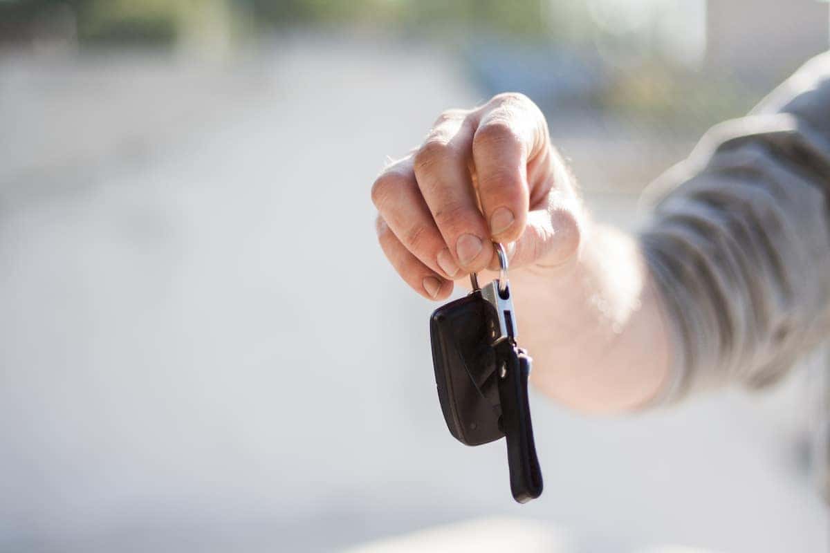 holding car keys