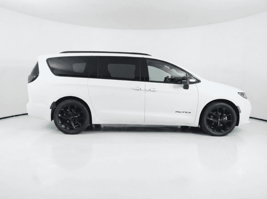 White Chrysler Pacifica minivan against a seamless white backdrop