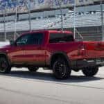 A red 2026 Ram 1500 truck at a race track