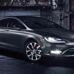 A dark Chrysler 200 sedan illuminated by headlights, parked in a dimly lit urban environment with a gritty backdrop of exposed brick walls, emphasizing the car's stylish design.