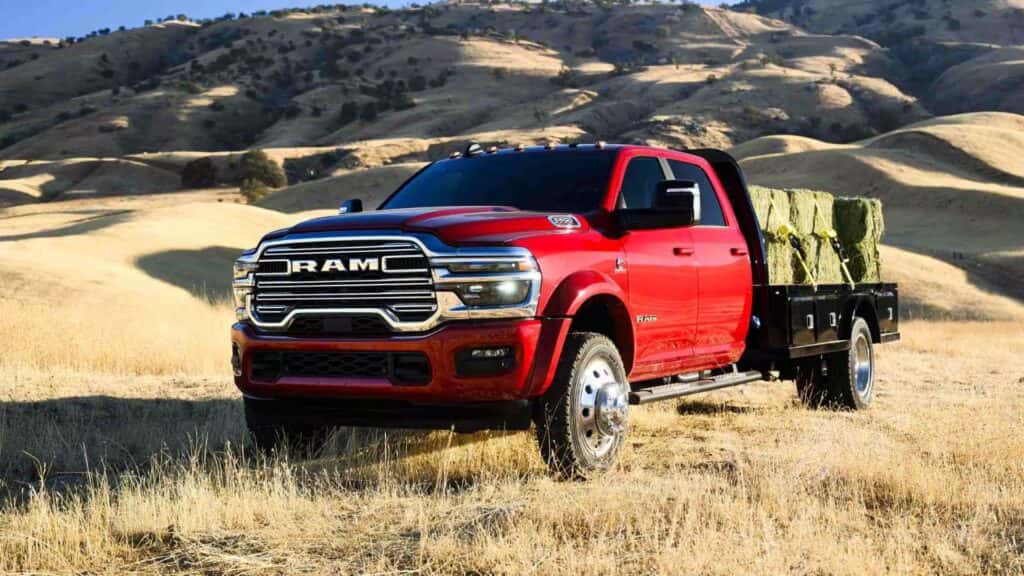 Dodge RAM 2500 in field with upfit flatbed to carry hay