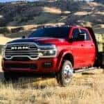 Dodge RAM 2500 in field with upfit flatbed to carry hay
