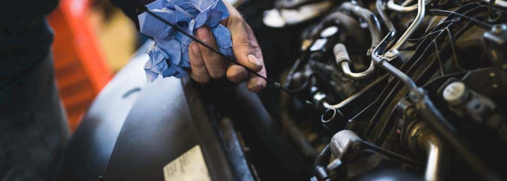mechanic working on mazda engine
