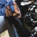 mechanic working on mazda engine