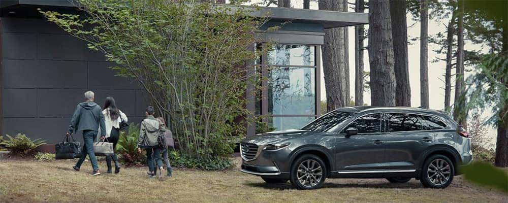 2020 Mazda CX-9 parked by house in forest