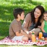 Family eating a picnic in the grass
