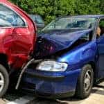 Car Collision Between Red and Blue Cars