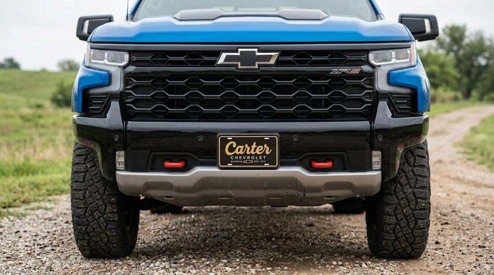 2026 Chevrolet Silverado 1500 ZR2 blacked-out front end with red tow hooks and skid plate