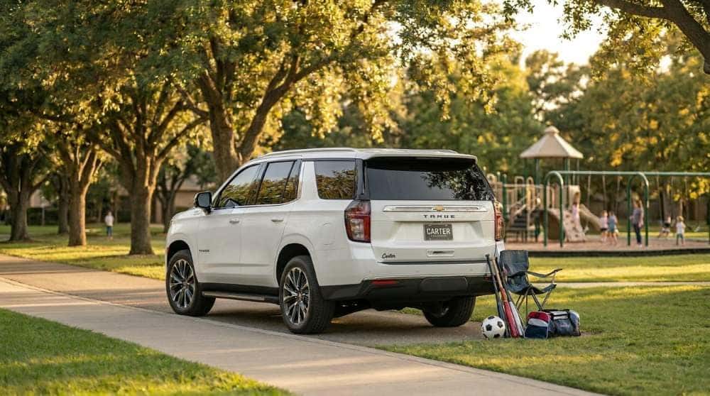 2026 Chevrolet Tahoe parked at a leafy suburban Edmond park on a sunny family afternoon