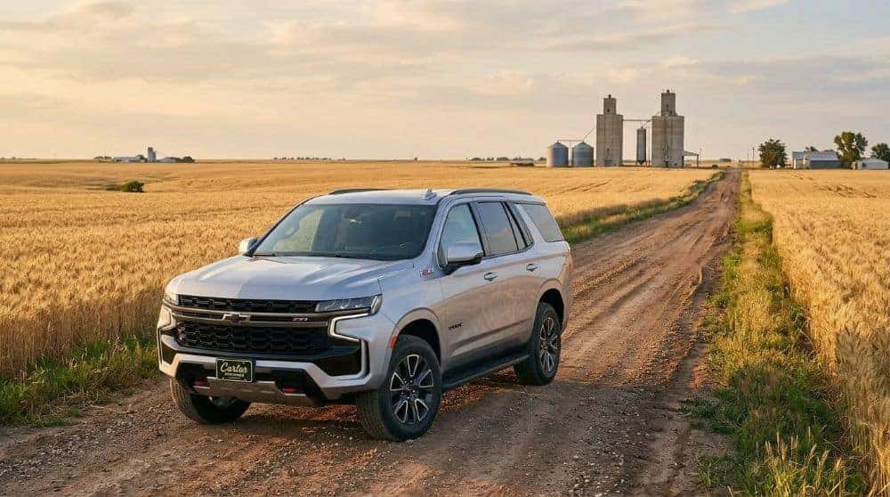 2026 Chevrolet Tahoe beside golden wheat fields under a wide Oklahoma sky near Enid