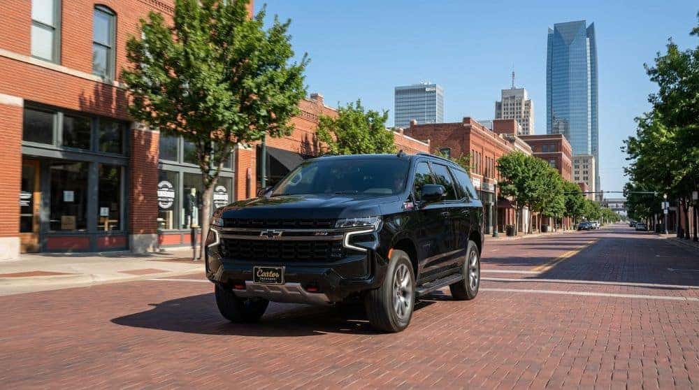 2026 Chevrolet Tahoe driving through downtown Oklahoma City with the skyline in the background
