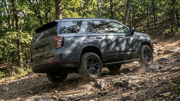 2026 Chevrolet Tahoe Z71 showing off-road capability on rugged terrain with all-terrain tires
