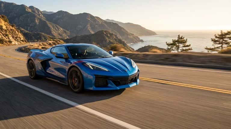 2027 Chevrolet Corvette Grand Sport in blue on an open road at golden hour