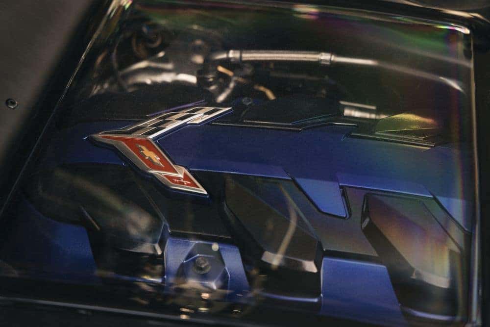 2027 Chevrolet Corvette LS6 6.7L V8 engine displayed under the rear glass
