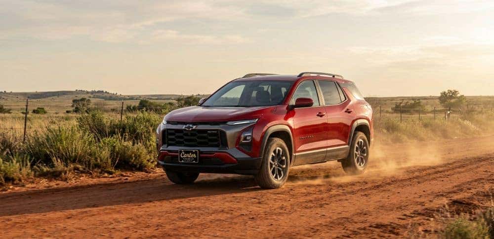 2027 Chevrolet Equinox ACTIV with all-terrain tires on a red-dirt Oklahoma county road