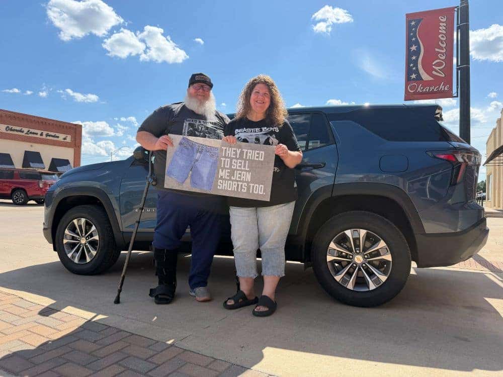 Customer receiving keys to a new 2027 Chevrolet Equinox at Carter Chevrolet