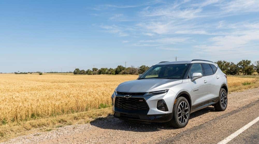 Silver Chevrolet Blazer RS beside a wheat field in Kingfisher County, Oklahoma