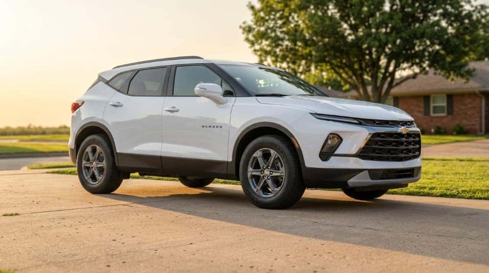 White Chevrolet Blazer parked in the driveway of an Oklahoma home at early evening