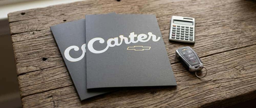 Customer completing a vehicle purchase and financing at Carter Chevrolet