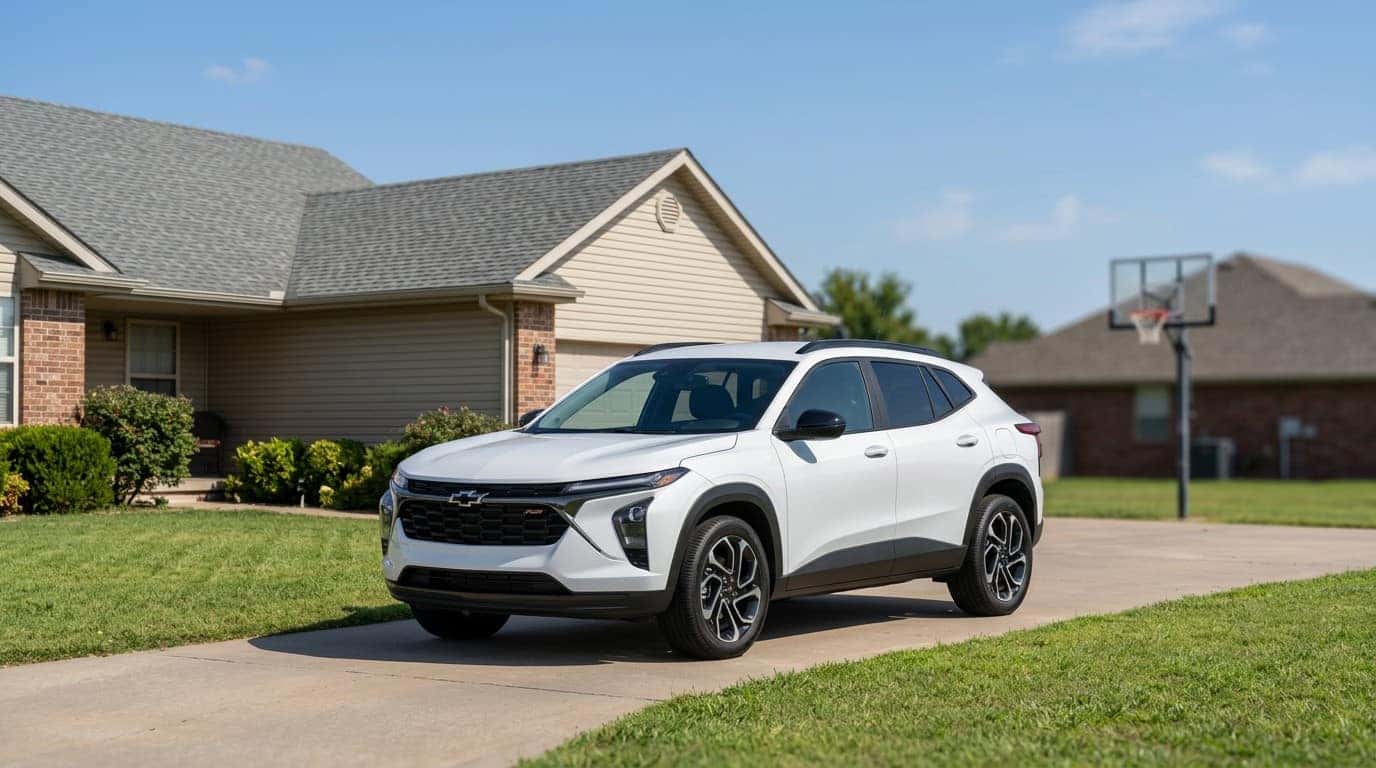 Chevrolet Trax parked in a driveway in front of a suburban home