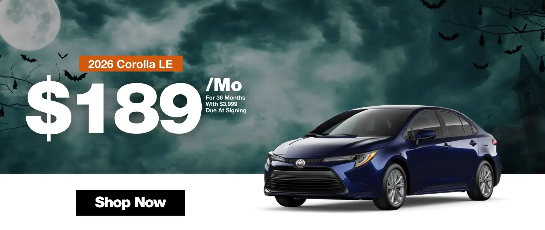 2026 Toyota Corolla LE lease offer for $189 per month for 36 months with $3,999 due at signing. Blue sedan displayed against a spooky Halloween background with a full moon, bats, and a Shop Now button.