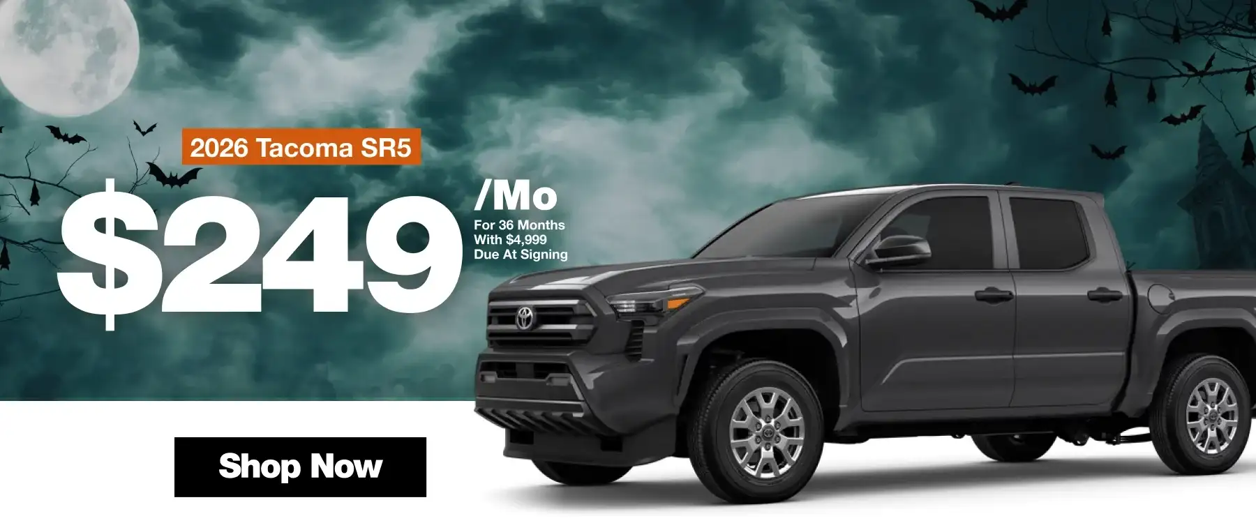 2026 Toyota Tacoma SR5 lease offer: $249 per month for 36 months with $4,999 due at signing. Halloween-themed background with a gray Tacoma and Shop Now button.