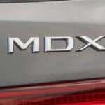 Close on MDX badge of silver 2020 Acura MDX