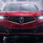 Red 2020 Acura MDX PMC front with water jets spraying on it