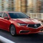 Acura TLX in san marino red on road