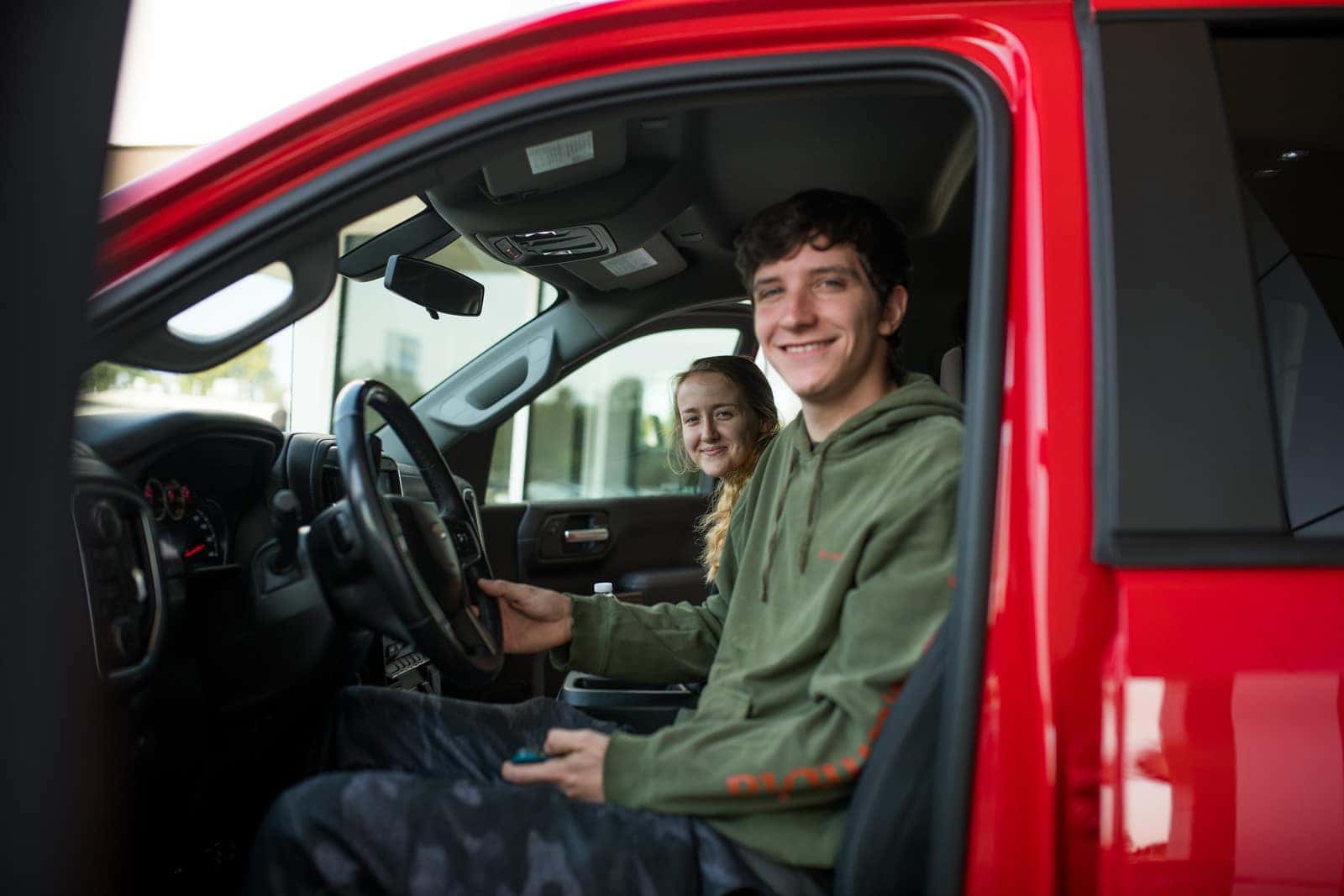 A couple that just got pre-approved for a vehicle