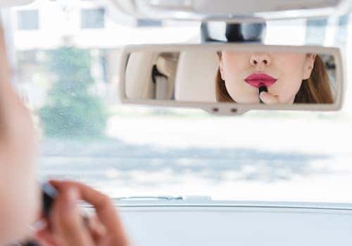 Applying makeup in car