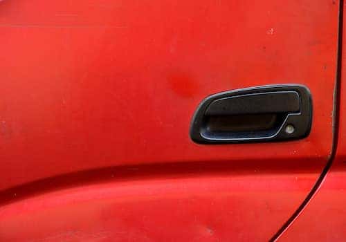 Red car door with black handle
