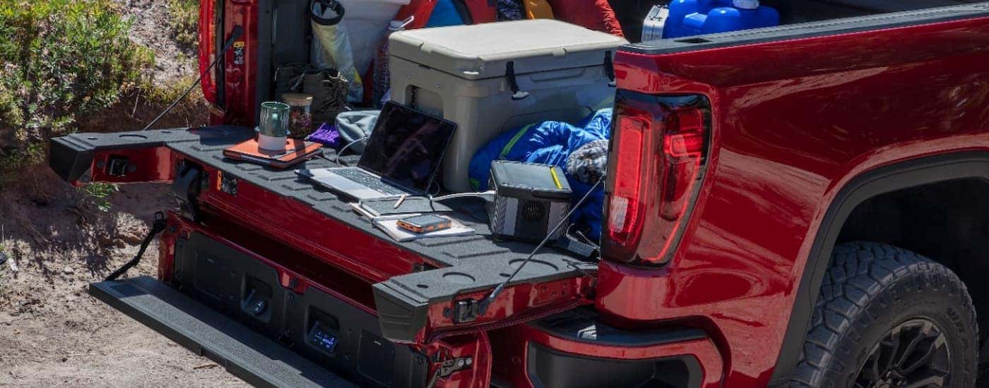 A close up of the bed of a 2022 GMC Sierra 1500 AT4X is shown full of cargo.