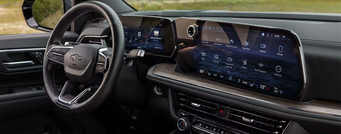 Side view of the steering wheel and infotainment screen in a 2025 Chevy Tahoe.