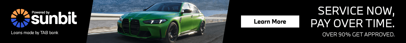 Green BMW driving-sunbit financing
