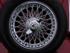 Intricate hubcap design of old tire.