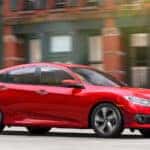 Red Honda Civic sedan on street