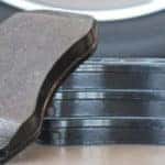 Brake pads stacked near tire
