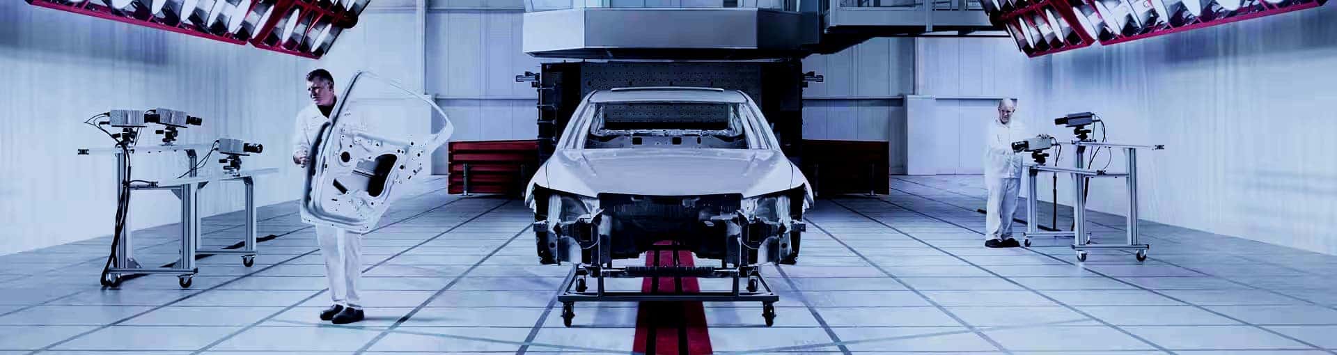 Text reads 'BUILT IN AMERICA' and many employees stand around a Honda Vehicle