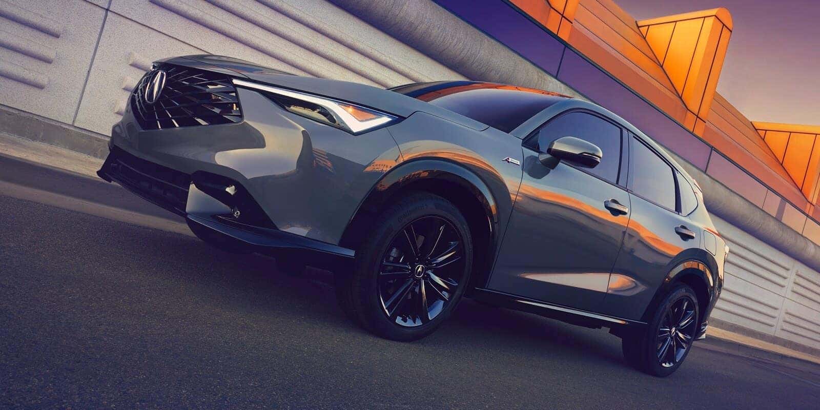 2026 Acura ADX parked against a modern architectural backdrop
