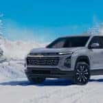Chevrolet SUV driving through snowy road in Indiana winter conditions