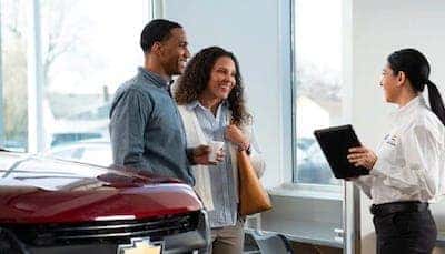 Greg Hubler Chevrolet sales consultant assisting customers in dealership showroom