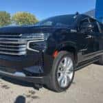 2024 Chevy Suburban black exterior front three quarter view at Greg Hubler Chevrolet Camby IN