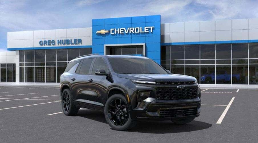 2025 Chevy Traverse SUV in front of Greg Hubler Chevrolet Camby IN showcasing midsize design