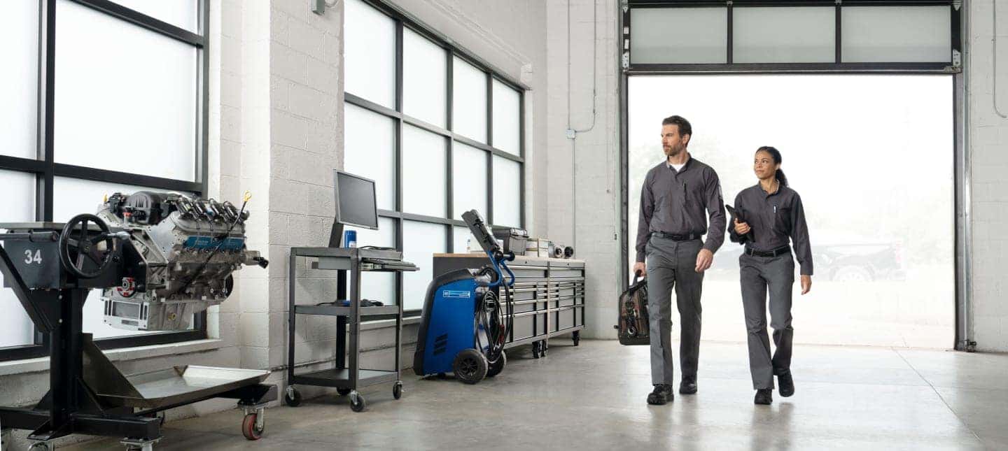 Certified technicians walking through the Greg Hubler Chevrolet service center in Camby IN