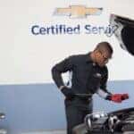 Certified Chevrolet technician performing winter maintenance service in Camby IN