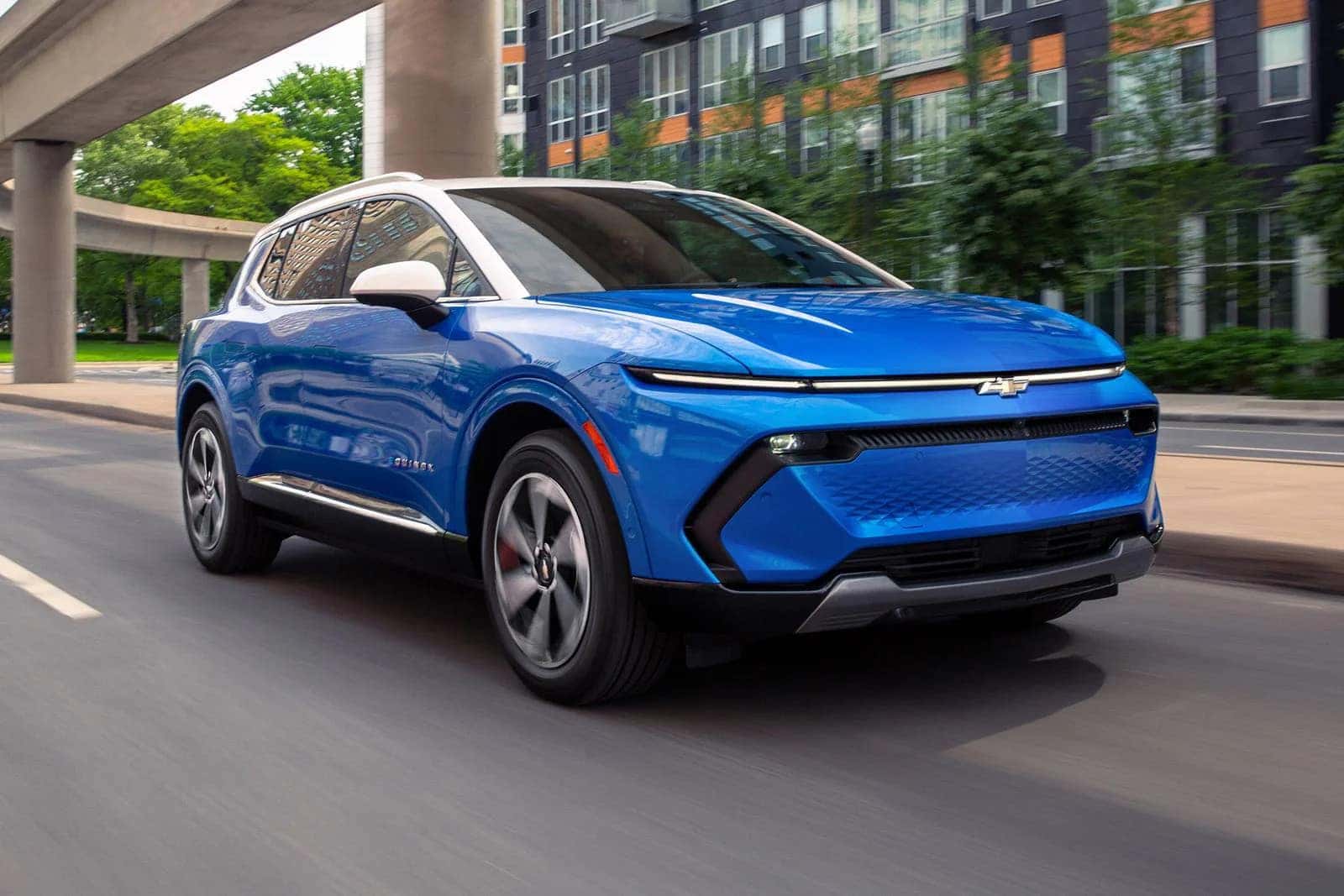 2026 Chevy Equinox EV driving around a city