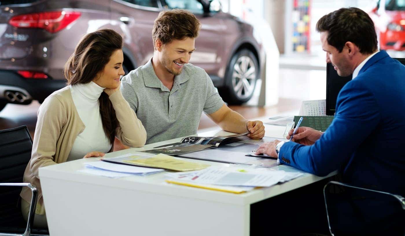 Customers completing financing at Heinrich Chevrolet